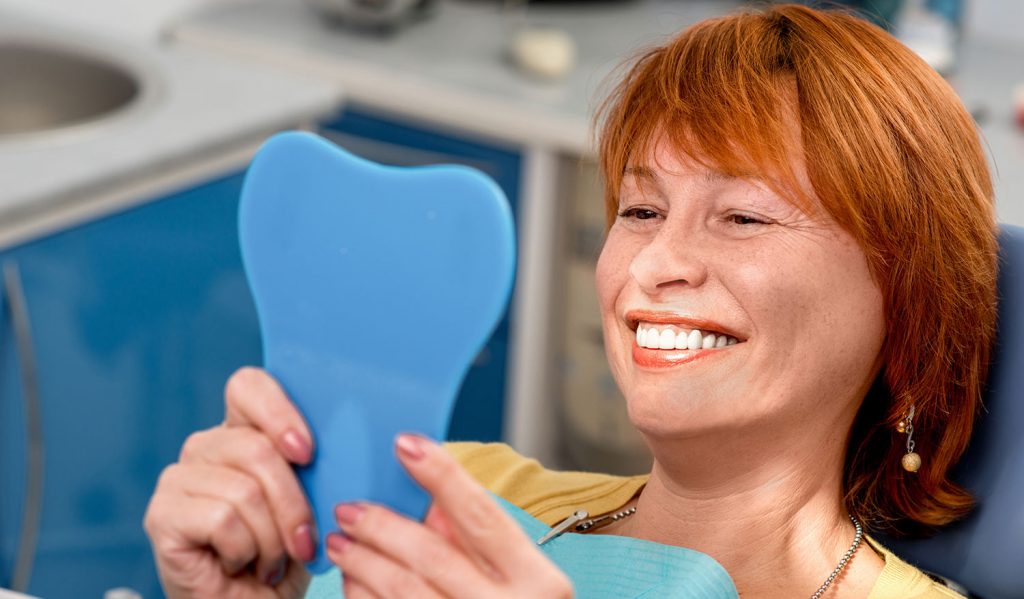 dental patient smiling after gum recession treatment